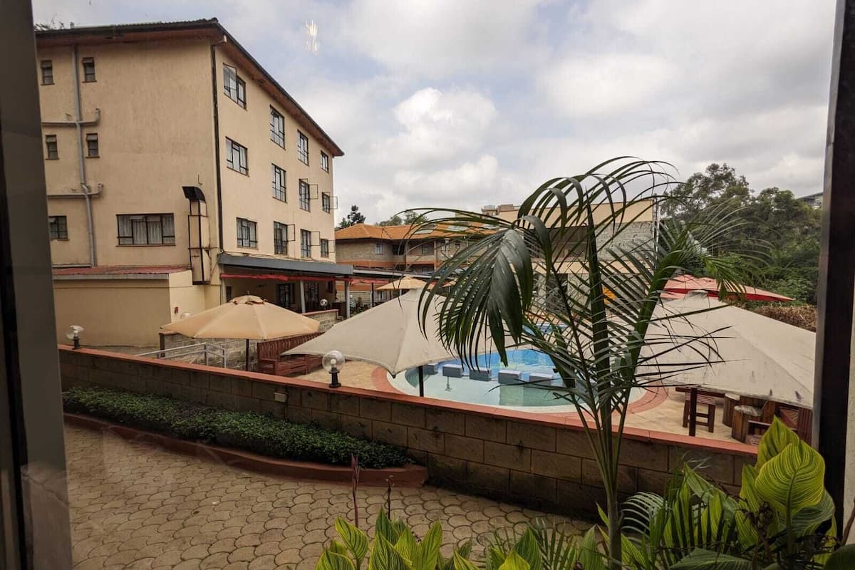 Outdoor pool, open 7:00 AM to 6:00 PM, pool umbrellas