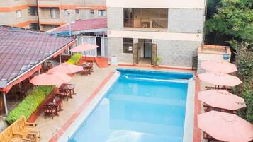 Outdoor pool, open 7:00 AM to 6:00 PM, pool umbrellas