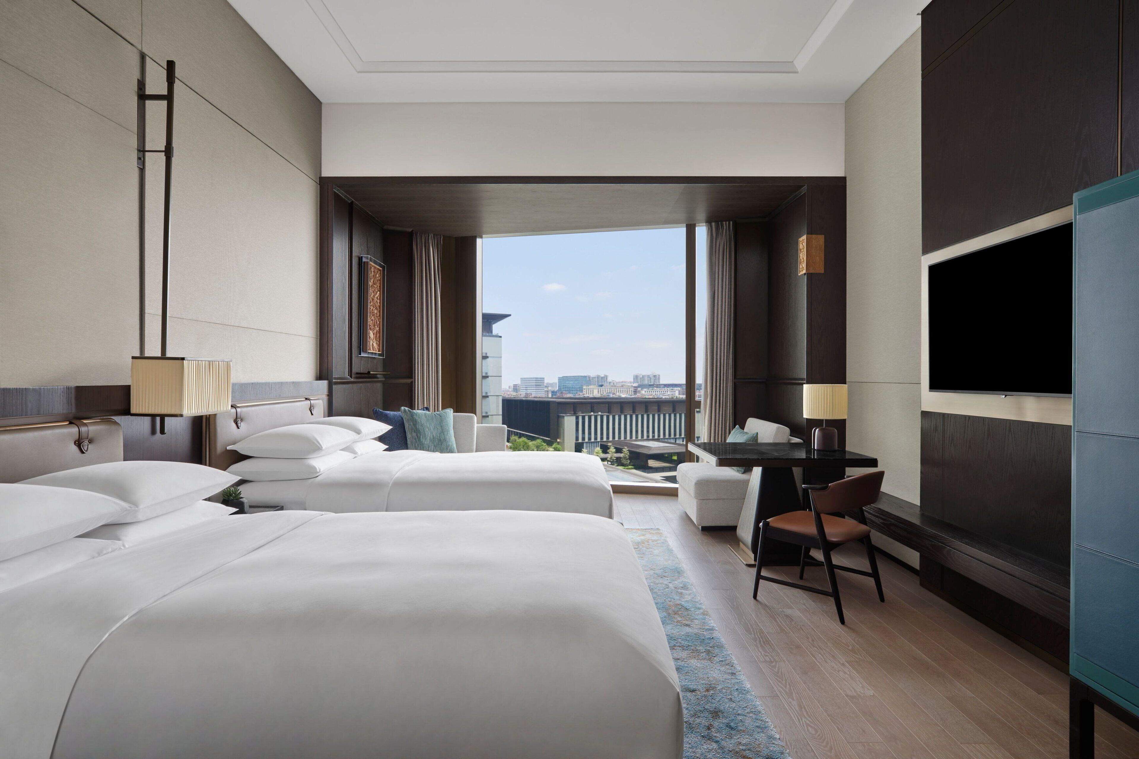 Premium bedding, down comforters, in-room safe, desk