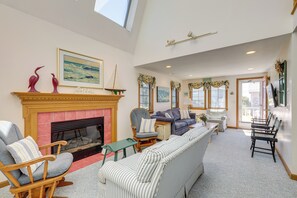 TV, fireplace, books