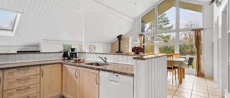Fridge, stovetop, dishwasher, coffee/tea maker