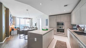 Luxury Apartment | Private kitchen | Full-size fridge, microwave, oven, stovetop
