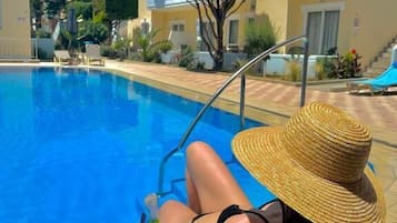 Seasonal outdoor pool, pool umbrellas