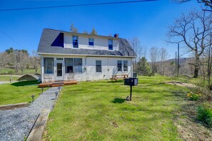 A two-story house with a front porch, a small deck, and a mailbox. - Virginia Getaway - Deck, Grill & Mountain Views! (Whitetop)