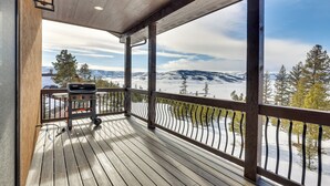 A wooden deck with a grill and a view of snow-covered mountains. - ~ 3 Mi to Granby Ranch: Spacious Cabin Home! (Granby)