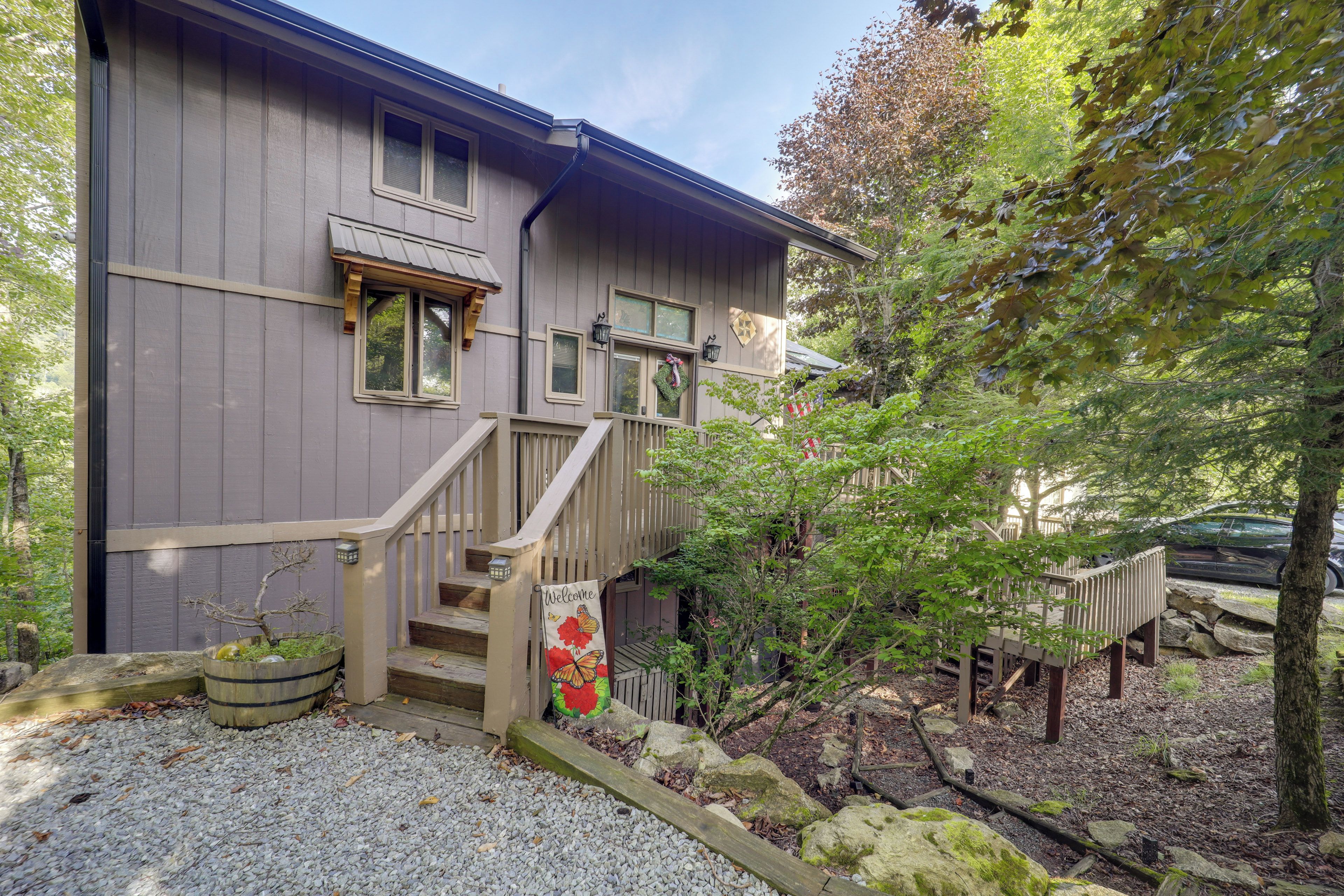 A two-story building with a wooden staircase leading to a porch.
