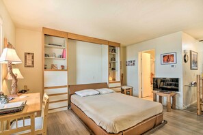 Laptop workspace, bed sheets