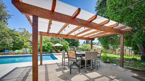 An outdoor patio with a pergola, pool, and seating area. - California Getaway w/ Private Outdoor Pool (Escondido)