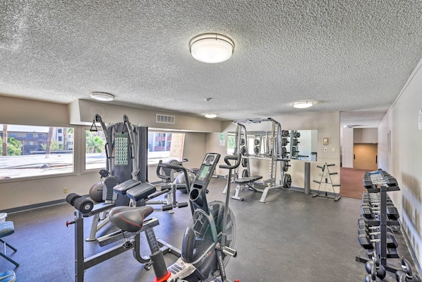 A gym with various exercise equipment, including treadmills, weight machines, and free weights. - Lounge Poolside: Resort Condo 1 Mi to Old Town! (Scottsdale)
