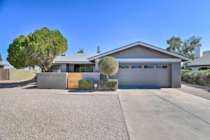 A modern single-story house with a garage, a driveway, and a well-maintained lawn. - 1 Mi to Dobson Ranch: Modern Escape w/ Gazebo! (Mesa)