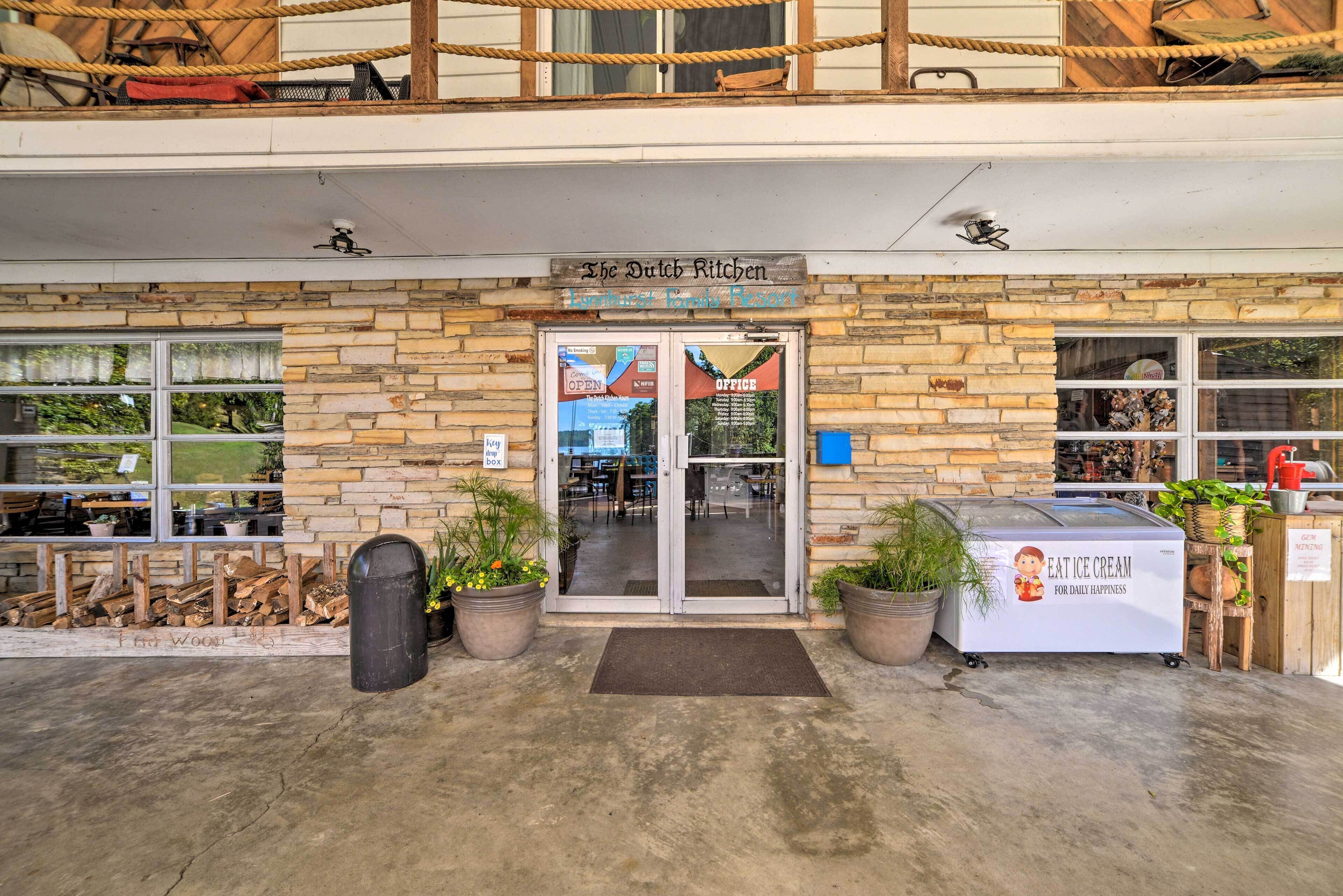 A restaurant named "The Dutch Kitchen" with a stone facade, large windows, and outdoor seating.