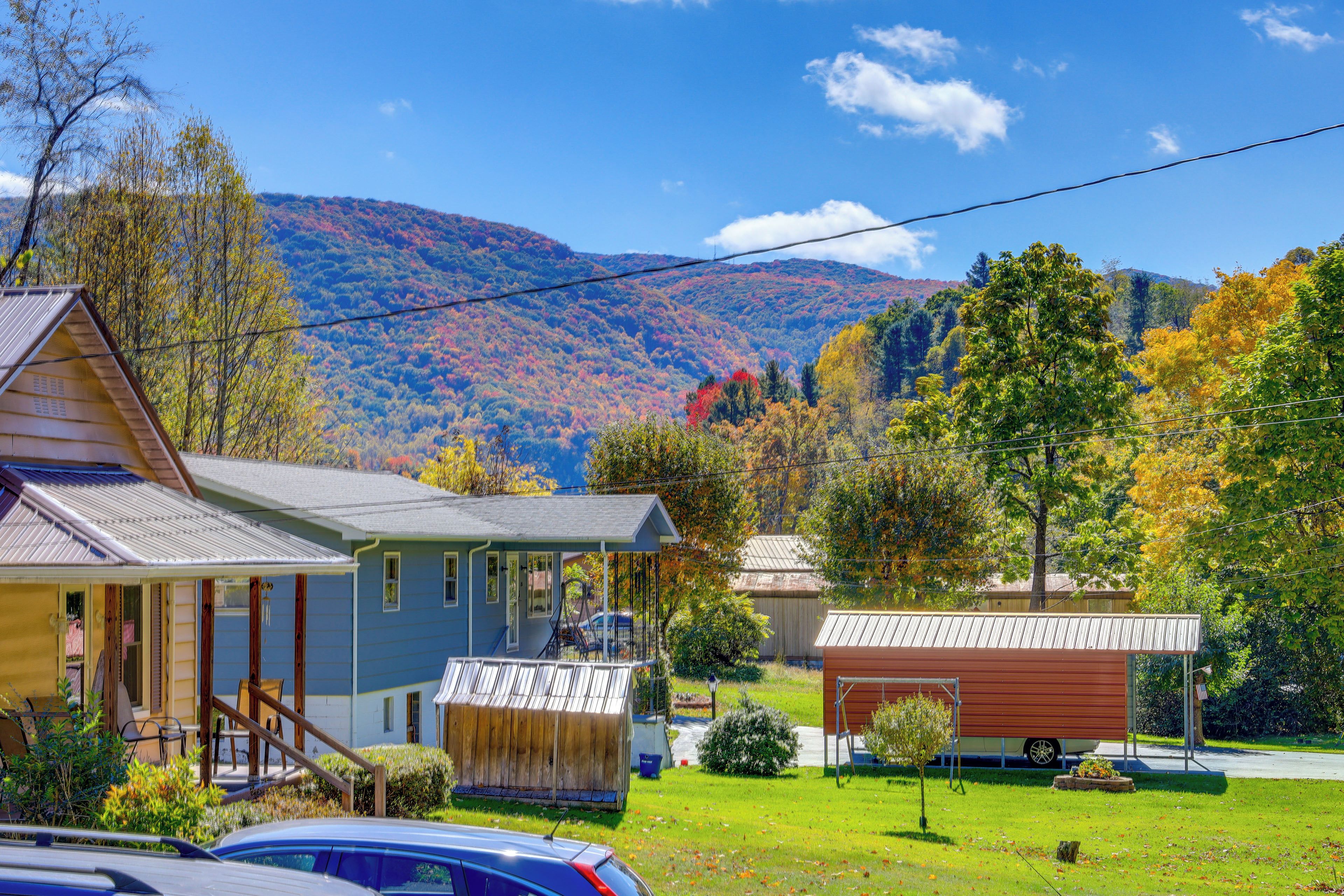 A residential area with houses, a covered porch, and a garage.