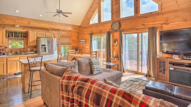 A spacious cabin with a large living area, a kitchen, and a dining area. - Grand Windham Retreat w/ Fire Pit & Game Room (Windham)