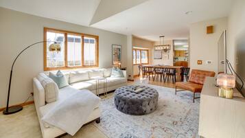 Cottage (4 Bedrooms) | Living area | TV, fireplace, books