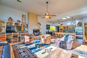 TV, fireplace, books - Luxe Apache Junction Escape w/ Pool & Hot Tub (Apache Junction)