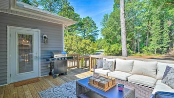 Relax on the deck with a grill and comfortable seating area.