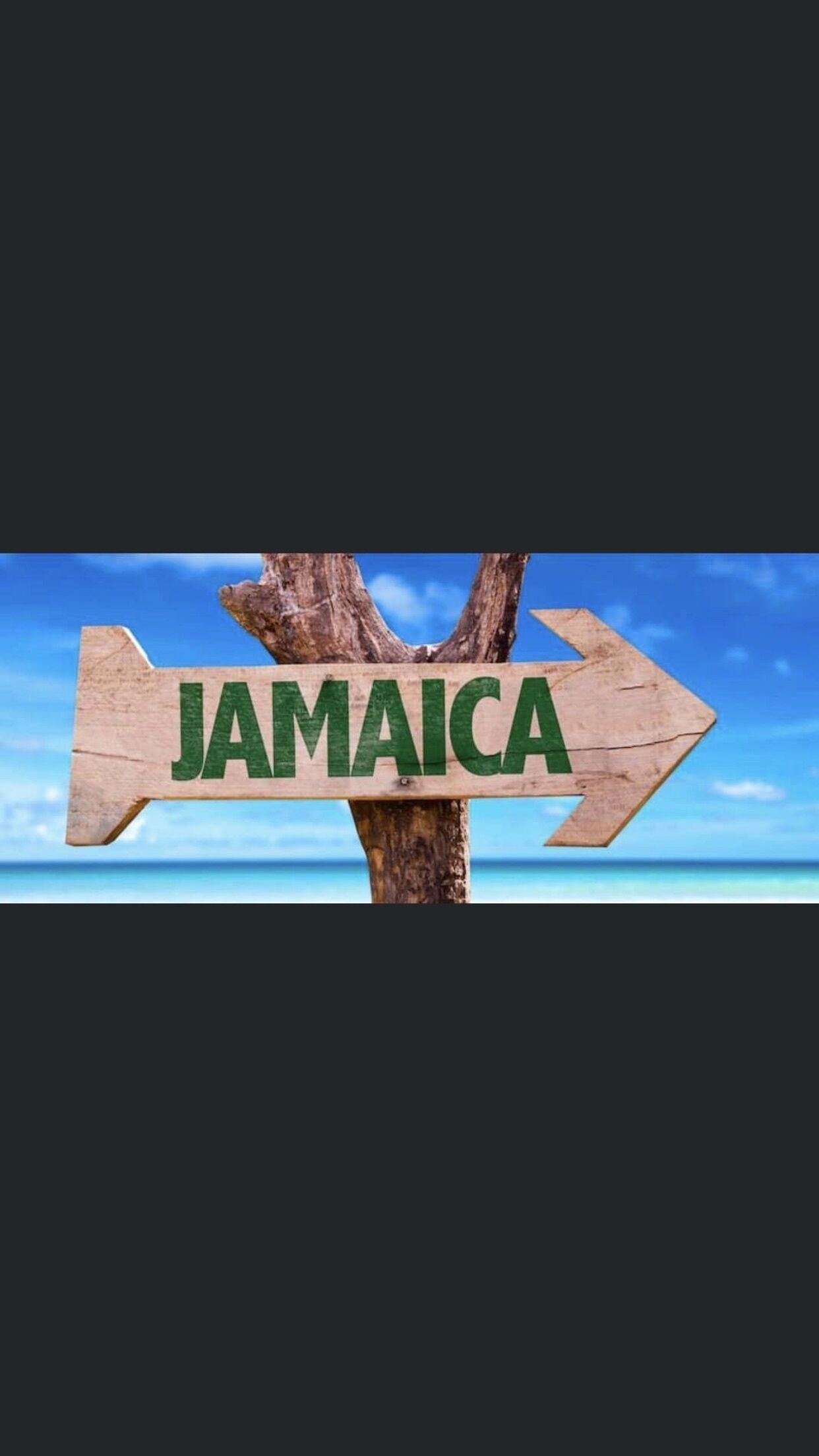 A wooden sign with the word "JAMAICA" pointing to the right.