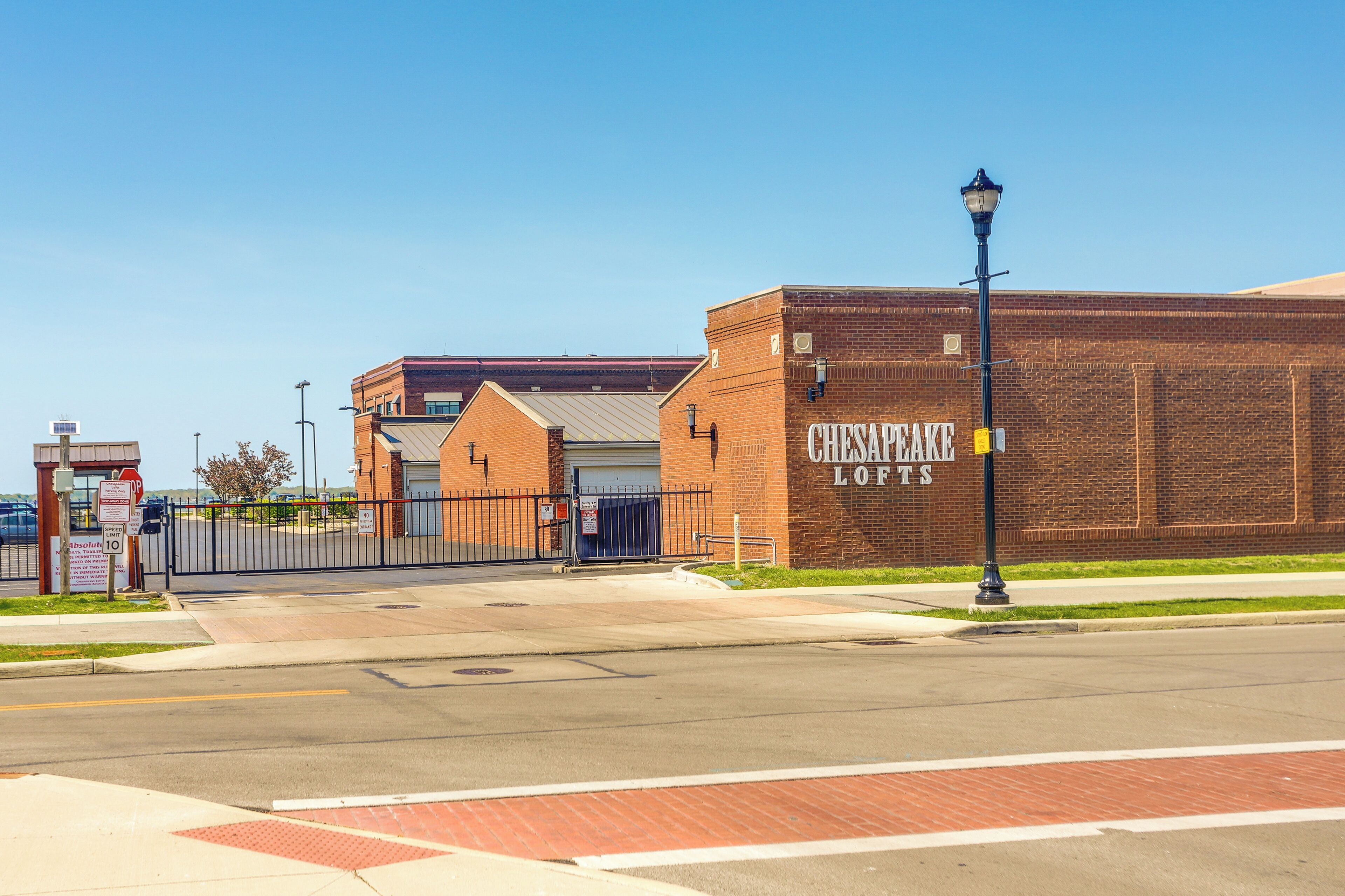 A brick building with a sign reading "Chesapeake Lofts".