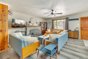 House (3 Bedrooms) | Living area | TV, fireplace, books