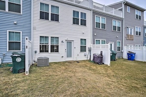 Attached townhouses with front doors, windows, and porches.