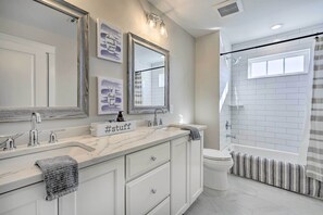 A modern bathroom with a large mirror, two sinks, a toilet, and a shower. - Long Branch Home < 1 Mi to Beach! (Long Branch)