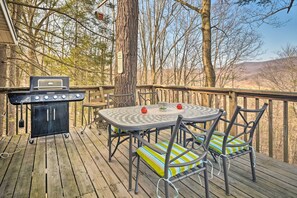 Enjoy al fresco dining on the deck with a barbecue grill and comfortable seating for two.