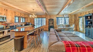 A log cabin interior with a kitchen, dining area, and living room. - Furnished Patio & Fire Pit: Pinetop Cabin! (Pinetop)