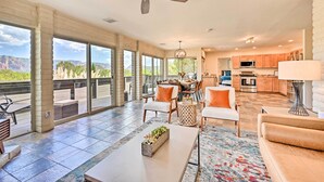 A spacious living area with a balcony, a dining area, and a kitchen. - Patio & Panoramic Desert Views: Sedona Getaway! (Sedona)