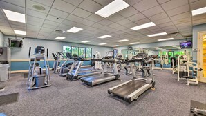 A gym with treadmills, elliptical machines, and weight equipment. - Pet-friendly Resort Home: Private Pool + Spa! (Bradenton)