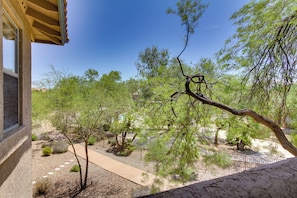 A view of a landscaped garden with trees and a pathway. - Work or Play! Resort-style Scottsdale Retreat (Scottsdale)