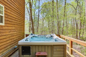 A wooden cabin with a hot tub on a deck surrounded by trees. - Dreamy Indiana Cabin Rental w/ Shared Amenities! (Taswell)