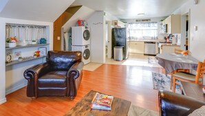 A compact living space with a dining area, a kitchen, and a laundry area. - 2 Mi to Dtwn: Cozy Getaway in Fairbanks! (Fairbanks)