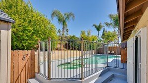 A fenced backyard with a swimming pool and a wooden fence. - El Cajon Oasis w/ Backyard 17 Mi to Dtwn San Diego (El Cajon)