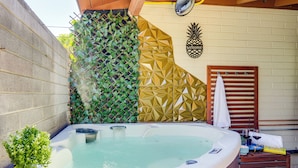 A hot tub with a geometric wall design, a wooden bench, and a pineapple sign. - 2 Mi to Asu: Studio w/ Private Hot Tub in Tempe (Tempe)