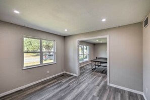 A room with a large window, a table, and a chair. - Spacious Fort Worth Getaway < 4 Mi to Dtwn! (Fort Worth)