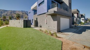 A modern two-story house with a flat roof, large windows, and a garage. - Modern Oasis w/ Mtn-view Pool Deck - Walk Downtown (Palm Springs)