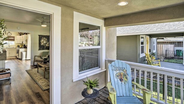 A porch with a wooden chair, a small table, and a potted plant. - Centrally Located House in Chico w/ Gas Grill (Chico)