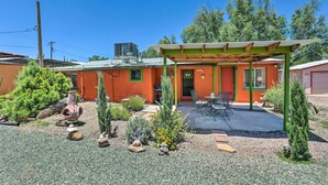 A residential property with a covered patio, outdoor seating, and a well-maintained garden. - Adobe-style Tumacacori Home w/ Trail Access! (Tumacacori)