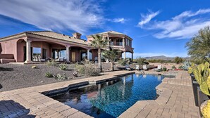 A large house with a swimming pool, outdoor seating, and desert landscaping. - Backyard Oasis! Mtn-view Family Gem in Scottsdale (Scottsdale)