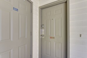 A closed door with a "Private Owner Use" sign and a no parking sign.