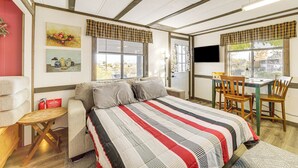 A bedroom with a bed, a desk, and a chair. There are two windows with curtains, a painting on the wall, and a red fire extinguisher on the floor. - 6 Mi to Old Town, Panoramic Views: Cottonwood Gem! (Cottonwood)