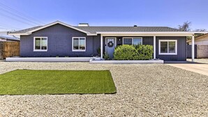 A modern two-story house with a grey exterior, a covered porch, and a well-maintained lawn. - 3 Mi to Asu! Snowbird Poolside Escape in Tempe (Tempe)