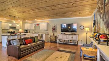 Relax in this inviting living space with a comfortable sofa and dining area, perfect for casual meals and gatherings.