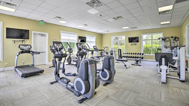 A gym with treadmills, elliptical machines, and free weights. - Sunny Ft Myers Abode w/ Community Amenities! (Fort Myers)