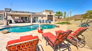 A pool area with lounge chairs and a house in the background. - 4 Mi to Lake Havasu State Park: Home w/ Pool (Lake Havasu City)
