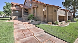 A two-story house with a tiled roof, a stone pathway leading to the front door, and a well-maintained lawn. - 5 Mi to Town Square Park: Condo in Sports Village (St. George)