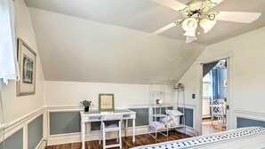 A bedroom with a bed, a desk, a chair, a ceiling fan, and a window. - Pet-friendly Pond View Loft' w/ Private Pool! (Pine Bush)