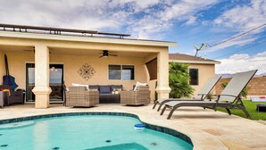 A covered patio area with a swimming pool, outdoor furniture, and a view of the mountains. - 4 Mi to Lake Access: Home w/ Lake & Mtn Views! (Lake Havasu City)