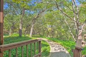 A wooden pathway in a wooded area with a wooden railing on one side. - Lake Granbury Getaway! Family Home w/ Deck & Games (Granbury)
