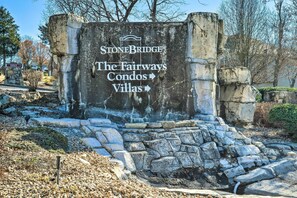 A sign for StoneBridge The Fairways Condos and Villas with directional arrows. - Branson Condo w/ Balcony on Ledgestone Golf Course (Branson West)